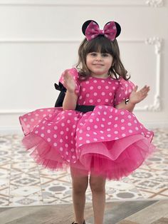 Make your little one's special day unforgettable with our charming Hot Pink Minnie Mouse Dress! Perfect for 1st birthday celebrations, photoshoots, or any occasion where you want to add a touch of magic. Features: Vibrant Hot Pink Color: Eye-catching and perfect for your little princess. Classic Minnie Mouse Design: Adorable polka dot pattern with Minnie Mouse-inspired details. Comfortable Fit: Soft and breathable fabric to keep your child comfortable all day long. Perfect for Photoshoots: Ideal 1st Birthday Photoshoot Outfit, Pink Minnie Mouse Costume, Pink Minnie Mouse Dress, Minnie Costume, Minnie Mouse Costume, 1st Birthday Photoshoot, Mouse Dress, Mouse Costume, Minnie Mouse Dress