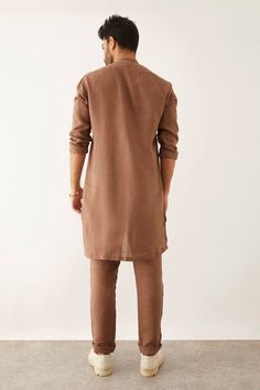 Brown kurta with double front button detailing and round high neckline. Paired with flat front trouser.
Components: 2
Type Of Work: Plain
Neckline: Round high neck
Sleeve Type: Three quarter
Fabric: 100% Linen
Color: Brown
Other Details: 
Front button detailing
Side slit
Occasion: Sangeet - Aza Fashions Kurta For Men, Kurta Set For Men, Linen Color, Fashion App, Band Collar, Kurta Set, High Neckline, Aza Fashion, Sleeve Type