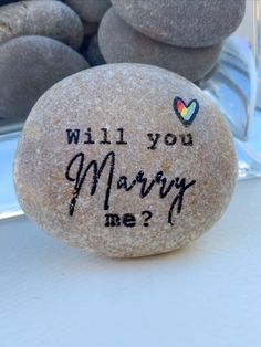 She could keep this cute stone keepsake on the working table, on a shelf or in a pocket and feel your hugs and love whenever needed.

🤍🤍🤍 Proposal stone "Will you marry me" with red heart: www.etsy.com/listing/1405068915/alternative-proposal-will-you-marry-me
🤍🤍🤍 Look more love pebble art in my Etsy shop🤍🤍🤍: www.etsy.com/shop/LiluFunnyStones Lgbtq Proposal Ideas, Lesbian Rings Engagement, Lesbian Proposal Ideas Unique, Lesbian Proposal Ideas, Lesbian Proposal, Wedding Lesbian Ideas, Marriage Proposal Quotes, Lesbian Engagement Ring