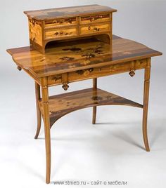 an old desk with a drawer on top