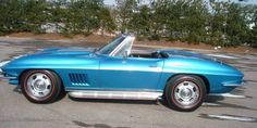 a blue car parked in a parking lot