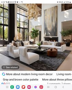 a living room filled with white furniture and lots of windows