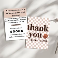 two business cards with the words thank you on them and an image of a flower