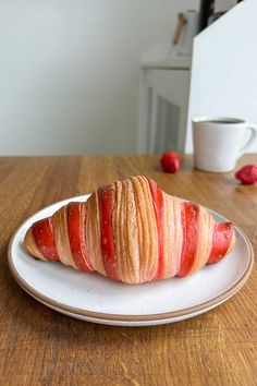 a piece of fruit is sitting on a plate