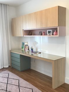 a room with a desk and shelves on the wall