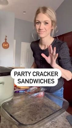 a woman standing in front of an open crock pot with the words party cracker sandwiches on it