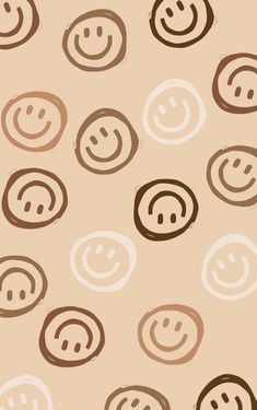 an image of a pattern with smiley faces on the wall in brown and beige colors