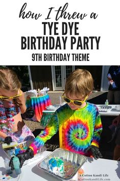 two young boys in tie - dye shirts and sunglasses are eating cake at an outdoor birthday party