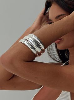 Silver-toned bangle pack Pack of three, fixed shape Princess Polly Lower Impact 100% reclaimed steel Chunky Silver Jewellery, Coachella 2024, Womens Silver Jewelry, Silver Jewelry Box, Silver Bracelets For Women, Chunky Jewelry, Jewelry Lookbook, Sterling Silver Bangles, Silver Bangle