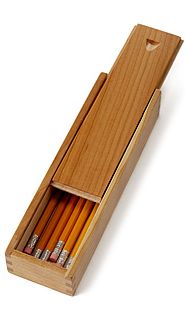 an open wooden box with pencils in it