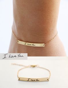 "This bracelet is the is the perfect heirloom piece. A bar charm is laser engraved with your handwriting for the perfect keepsake. Bar charm is stainless steel and plated in 18K gold. Bracelet requires little to no maintenance because stainless steel does not tarnish. Back of bracelet has three loops for attachment at 6\", 6.5\" and 7\". Details * Material - stainless steel * Bar measures 4mm by 35mm * total bracelet length is 7\" with clasp at 6\", 6.5\" and 7\" for the perfect fit. After you c Meaningful Engraved Name Bracelet, Minimalist Engraved Charm Bracelet For Personalized Gift, Minimalist Engraved Charm Bracelet As Personalized Gift, Minimalist Adjustable Jewelry With Engraved Text, Stainless Steel Laser Engraved Bracelets As Gift, Laser Engraved Stainless Steel Bracelets For Gift, Laser Engraved Stainless Steel Bracelets As Gift, Laser Engraved Stainless Steel Bracelet As Gift, Minimalist Engraved Text Bracelet For Gift