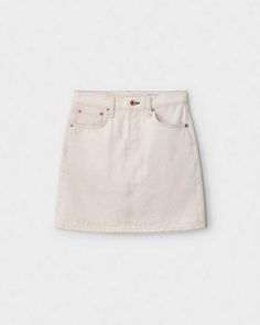 The denim mini. A classic rag & bone silhouette with a high rise waist and a button fly. Cut for the season from a 100% organic cotton Italian ecru, washed in a light natural shade. Cut off hem. Made in the USA. rag & bone Women's Denim Skirt | Ecru, 32 (also in 23,24,25,26,27,29,30) Womens Denim Skirts, Velvet Mini Skirt, Mini A, Skirt With Buttons, Crochet Halter Tops, Natural Shades, Rag And Bone, Distressed Black Jeans, Denim Mini