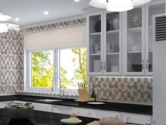 a kitchen with black counter tops and white cabinets