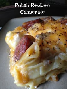 a close up of a plate of food with cheese and bacon on it, text reads polish reuben casserole