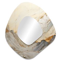 a mirror that is sitting on top of a wooden object with a white and gold design