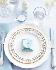 a place setting with napkins and silverware