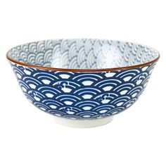 a blue and white bowl with waves on it