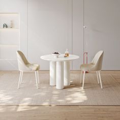 a white table and two chairs in a room