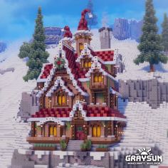 a large house made out of legos in the middle of a snow covered field