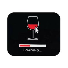 a glass of red wine sitting on top of a black coaster that says loading with an arrow pointing to the left