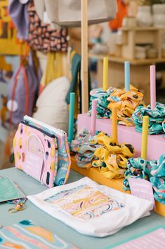 the table is covered with colorful items for children's birthdays and baby showers