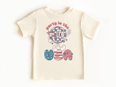 This 4th of July shirt would make the perfect patriotic shirt for your toddler. Whether it's 4th of July, Memorial Day or Labor Day, this is sure to be a hit! Toddlers love to get in on the fun and celebrate the USA. This vintage style top features an all over print of vintage looking design, perfect for showing off your red, white and blue.  DESIGN SPECIFICS: We use high quality direct to garment (DTG) process which makes the design naturally blend into the fabric, making it very soft to touch. PROCESSING TIME: Made to Order Please allow 1-3 business days for your order to be completed. SHIPPING TIME: Depends on the shipping method chosen and destination, but in general after the order is placed, the package will arrive within 6 business days for domestic first-class shipping.  For more d Fun American Flag Print Top For 4th Of July, 4th Of July Birthday T-shirt With Graphic Print, Graphic Print T-shirt For 4th Of July Birthday, Independence Day Graphic Print Birthday Top, Patriotic Top For 4th Of July Birthday, Patriotic Tops For 4th Of July Birthday, Funny 4th Of July, Fourth Of July Shirts, Usa Shirt