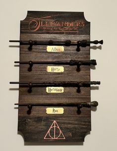 the harry potter wands are hanging on the wall