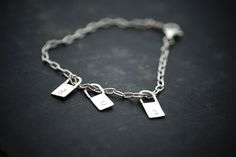 "This bracelet features handmade sterling lock shaped charms. I love these charms so much. You have the option to stamp each charm with a letter, number, heart, cross, horseshoe, anchor, or the word 'love'. You may add as many charms as you wish. Charms hang on a perfect sterling elongated cable link chain. Locks measure 1/2\". CURRENT LEAD TIME ON ALL ORDERS: 2 Weeks SHIP TIME TO US: 2-7 business days SHIP TIME OUTSIDE US: Up to 8 weeks (although typically around 1-3 weeks)" Initial Charm Bracelet, Custom Initials, Letter Necklace, Initial Charm, A Letter, 8 Weeks, Lead Time, Sterling Ring, Charm Bracelets