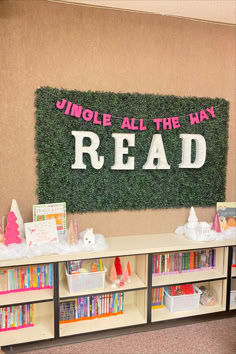 a room with bookshelves and a sign that reads, uncle all the way read