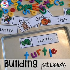 a tray filled with cut out letters and words to help students learn the letter sounds