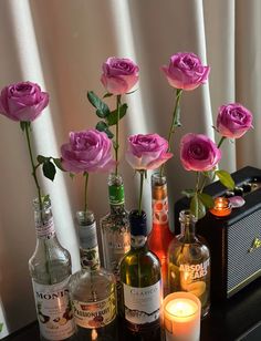 flowers and liquor bottles sitting on a table