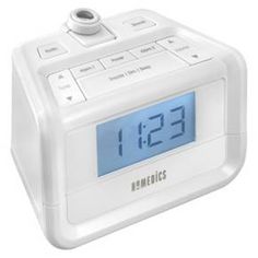 the alarm clock is white and has blue numbers