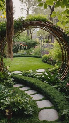 a garden with grass and stepping stones leading to a large circular trellis in the center