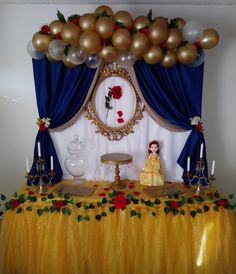 a beauty and the beast themed birthday party with balloons, decorations, and table cloths