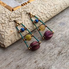 ✦Beautiful handmade and original designed purple/yellow/blue Czech glass beads and antique brass spacers statement bohemian earrings. ✦Spiritual Jewelry designed and carefully handmade by Rushweaver Jewellery in an ancient earthy Egyptian style. ✦These boho beauties dangle 60mm from the top of nickel free, solid brass, antique Bronze plated ear wires. ✦For all free spirited women who want to enjoy their unique style! ✦100% artisan made.. Earrings Boho Chic, Boho Chic Earrings, Buy Earrings, Earrings Purple, Chic Earrings, Earrings Inspiration, Earrings Bohemian, Yellow Earrings, Handmade Wire Jewelry