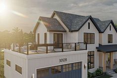 an artist's rendering of a two story house with garages and balconyes