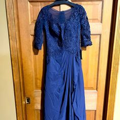 Lace Dress In Navy Blue Maxi Length Blue Long Sleeve Dress For Mother Of The Bride, Spring Blue Short Sleeve Mother Of The Bride Dress, Blue Fitted Long Sleeve Mother Of The Bride Dress, Blue Short Sleeve Evening Dress, Spring Blue Dress For Mother Of The Bride, Blue Fitted Short Sleeve Mother Of The Bride Dress, Blue Fitted Dress For Mother Of The Bride, Long Gauze Dress, Burgundy Gown