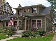 a house with an american flag on the front porch