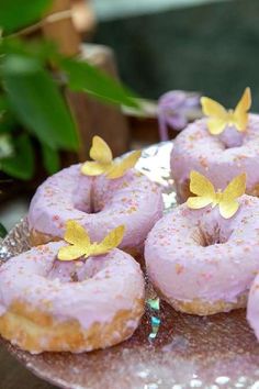 there are many donuts with butterflies on them