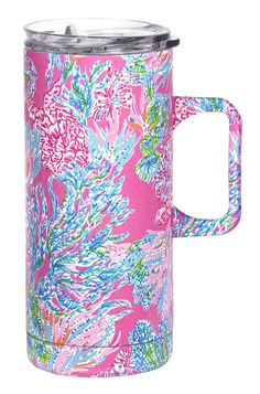 thermos travel mug in pink and blue with flowers on it, is shown