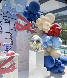 an airplane themed birthday party with balloons and decorations