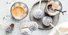 three desserts on a plate with ice and cinnamon sticks next to them, one is covered in powdered sugar