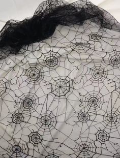 a black and white spider web fabric