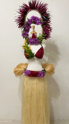 a sculpture made out of fake hair and flowers