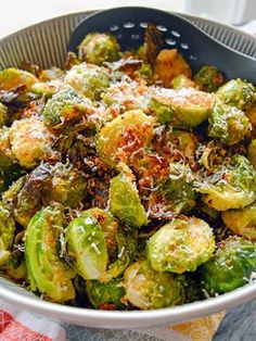 brussel sprouts with parmesan cheese in a bowl on a table