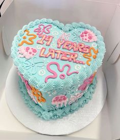 a heart shaped birthday cake in a box