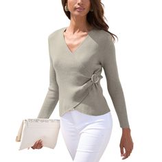 Look your best this season with the LASCANA Women's O-Ring Wrap Sweater, a stylish and flattering addition to your wardrobe. This sweater features a chic wrap design with a petal hem that beautifully accentuates your waist and adds a touch of femininity. The eye-catching o-ring detail brings a trendy flair, setting this piece apart from typical knitwear. Designed with fitted long sleeves, it provides warmth and elegance, making it perfect for layering or wearing on its own. Crafted from a luxuri Chic Faux Wrap Winter Tops, Chic Winter Faux Wrap Tops, Chic Wrap Sweater For Workwear, Chic Wrap Sweater For Work, Fitted Casual Wrap Sweater, Trendy Ribbed Stretch V-neck Sweater, Ribbed Stretch V-neck Sweater, Casual Stretch V-neck Wrap Top, Drop Sleeve Sweater