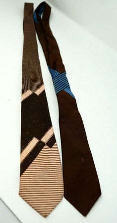 Vintage Men's Ties Wembley Brown w/ Blue Stripes 2.5" & Resilio Brown & Peach 3" Good condition, very little marks. Items are sold as is.  No Returns.  Send e-mail with any questions. PayPal only please. Payment must be received within 3 days of auction ending. Do not accept bids outside of the U.S.A. Will provide feedback when notified by the buyer that the item has been received safely and the transaction has been completed successfully. Ask all questions and understand all terms before auctio Vintage Brown Tie For Business, Vintage Brown Ties For Business, Vintage Brown Ties For Formal Occasions, Vintage Blue Ties For Business, Vintage Suit And Tie Accessories For Business, Vintage Business Ties, Vintage Formal Ties, Vintage Suit And Tie Accessories For Black Tie, Vintage Black Tie Accessories