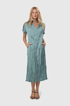 Roll it up and toss it in your carry-on. Crinkle is your best travel partner. This woven satin shirtdress in a soft teal hue is cut for relaxed comfort yet always looks chic. Pullover silhouette with spread collar, half-button placket, soft drop shoulders and cuffed short sleeves. This soft teal dress is the perfect color and length for an Easter celebration dress. Celebration Dress, Travel Partner, Teal Dress, Easter Celebration