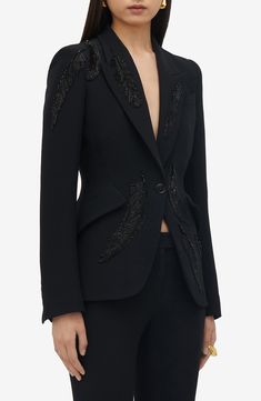 Intricately beaded feathers tonally detail this blazer Italian-tailored in the house's signature single-breasted silhouette. 26" length (size 40 IT) One-button closure Peaked lapels Four-button cuffs Chest welt pocket; front flap pockets Side vents Lined 52% viscose, 48% acetate Dry clean Made in Italy Designer Clothing Luxury Black Embellished Blazer, Designer Embellished Black Blazer, Designer Black Embellished Blazer, Luxury Embellished Outerwear With Notch Lapel, Luxury Embellished Blazer With Notch Lapel, Luxury Embellished Formal Blazer, Luxury Tailored Embellished Outerwear, Fitted Embellished Outerwear With Notch Lapel, Fitted Luxury Blazer With Sequins